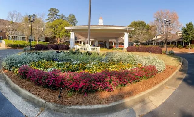 Beautifully landscaped entrance with colorful flowers