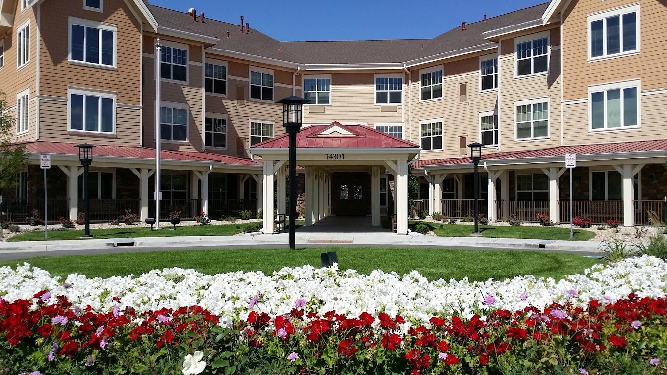 Exterior view of the assisted living facility with flowers