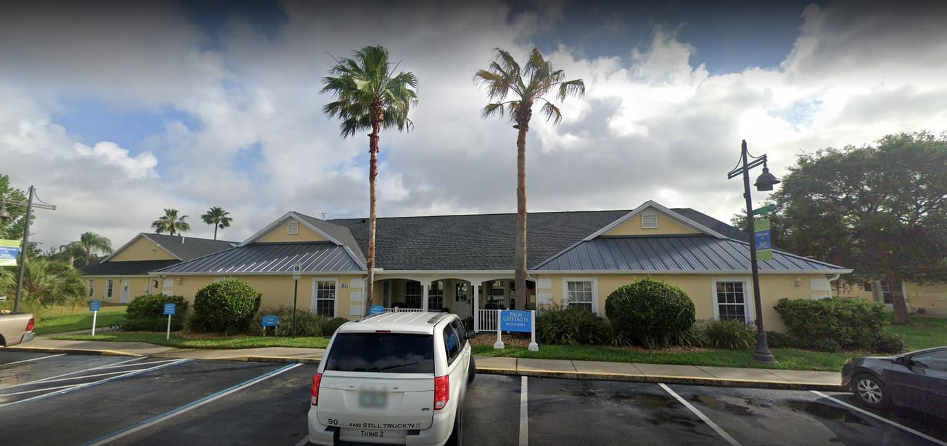 Exterior view of Palm Cottages of Rockledge with palm trees