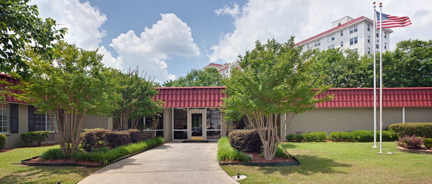 Front entrance of the facility with landscaped pathway