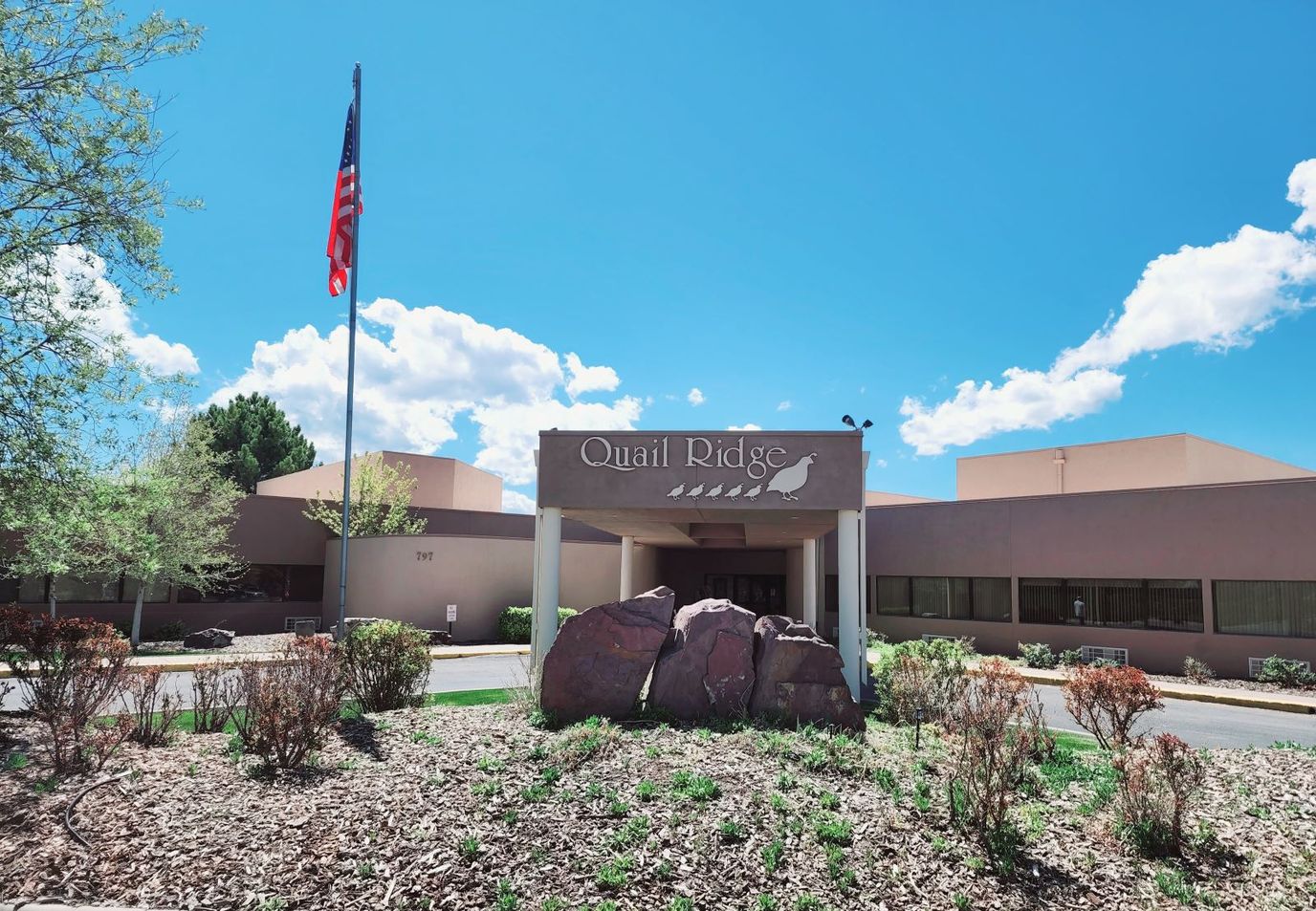 Exterior view of Quail Ridge facility with landscaping