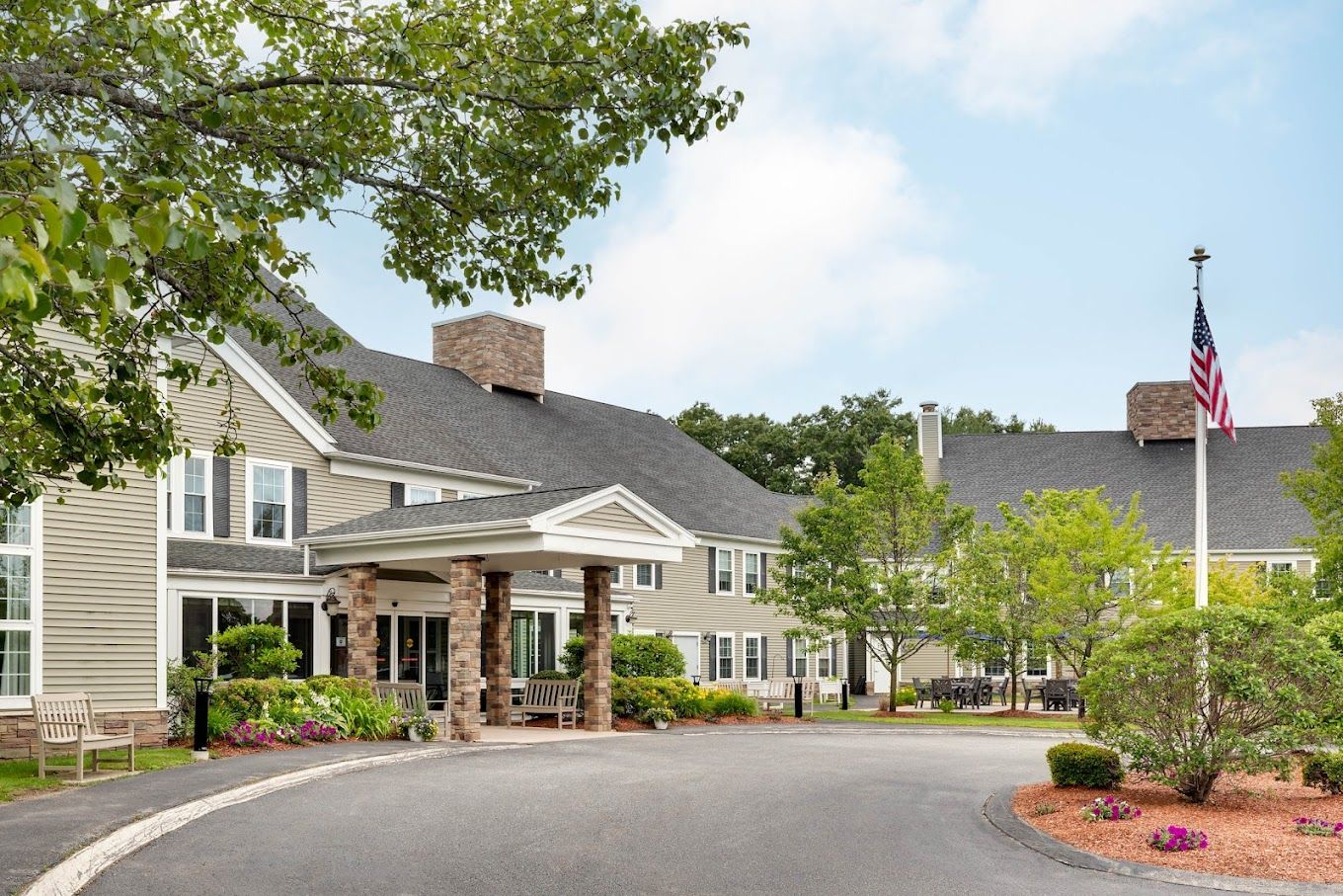 Exterior view of assisted living facility with landscaping