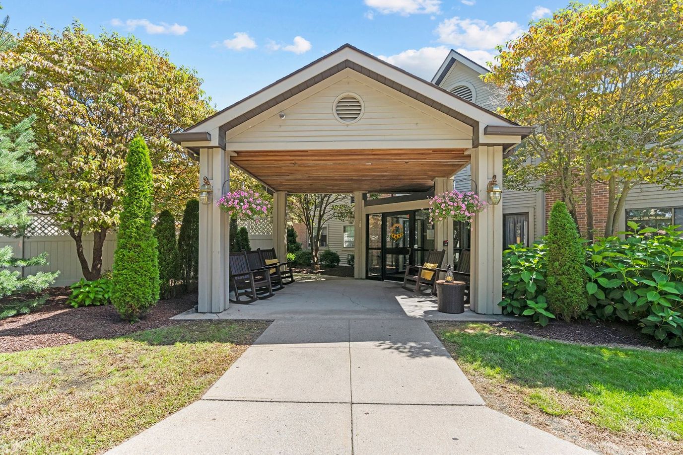 Covered entrance of assisted living facility with seating