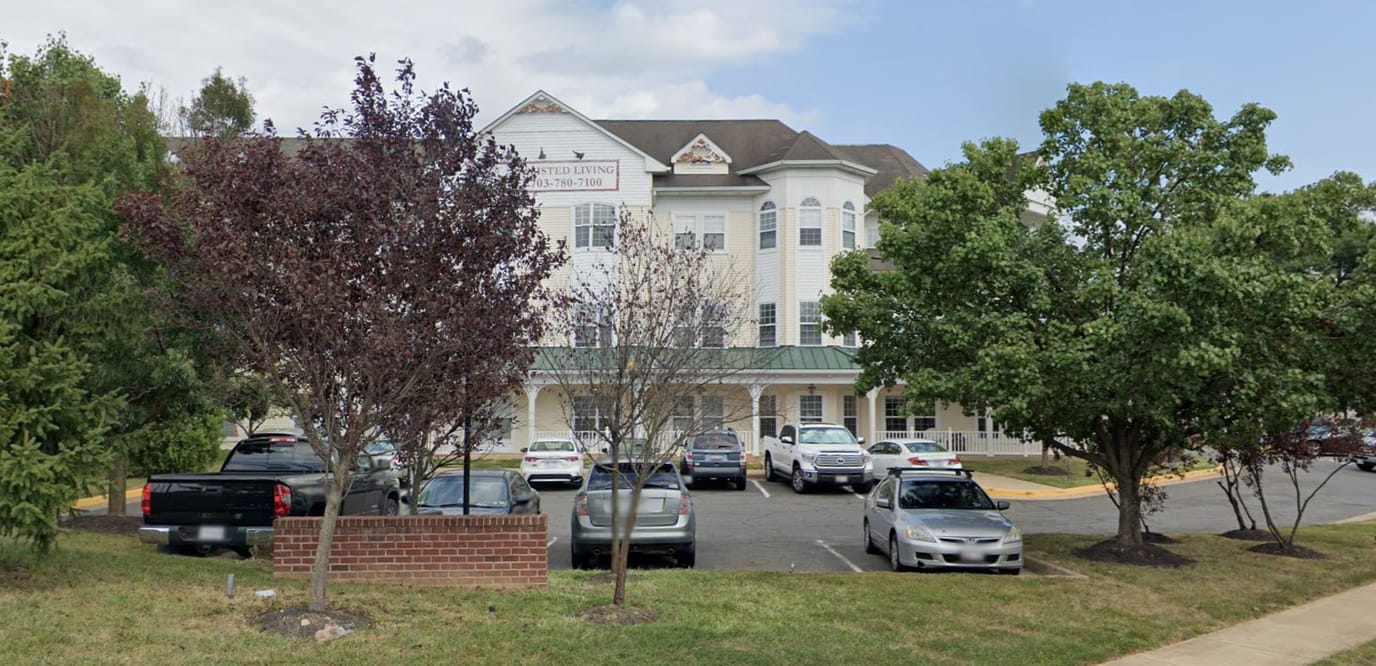 Exterior view of the facility with parking and trees