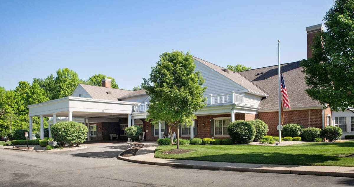 Exterior view of the nursing home facility with gardens