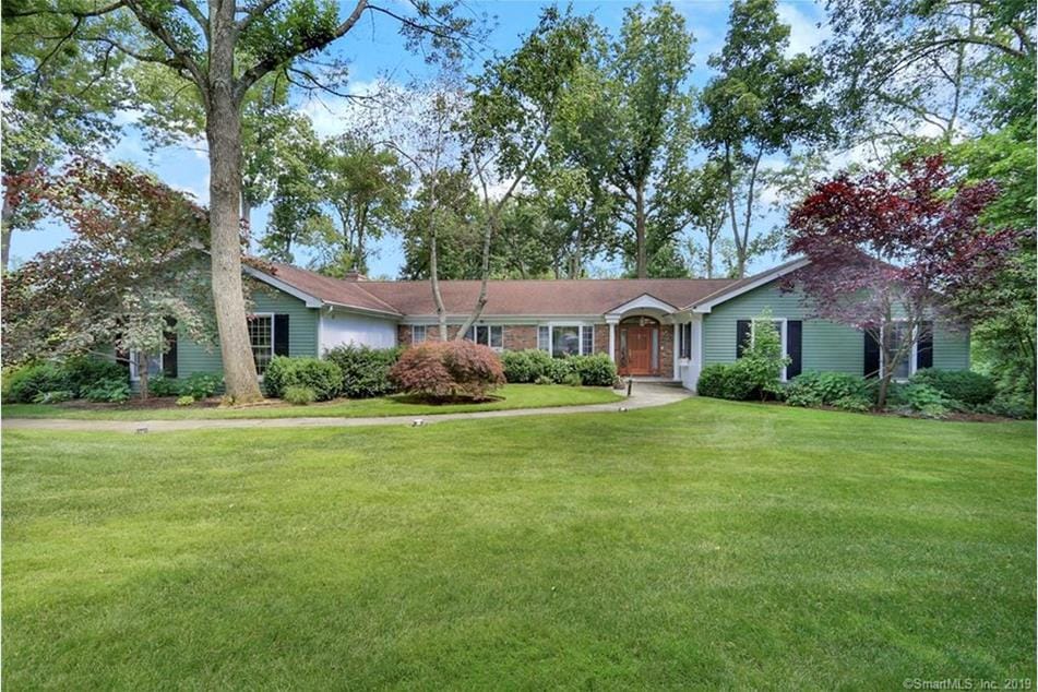 Exterior view of a residential facility with green landscaping