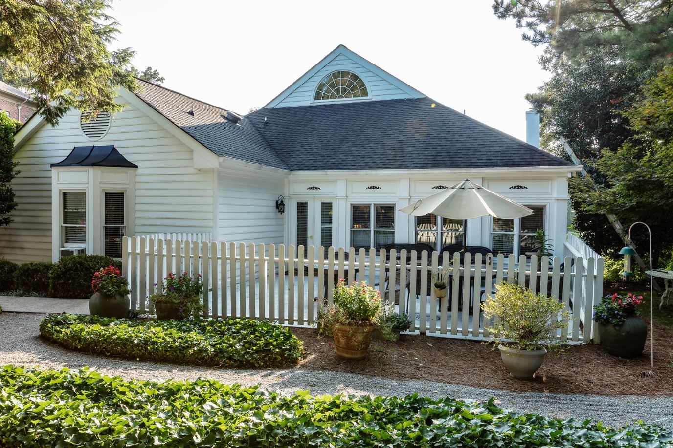 Exterior view of a senior living house with garden