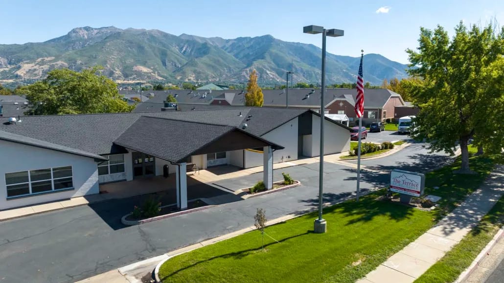 Exterior view of The Terrace at Mt. Ogden with mountains in the background