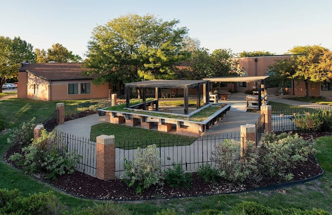 Outdoor space with shaded seating and landscaping