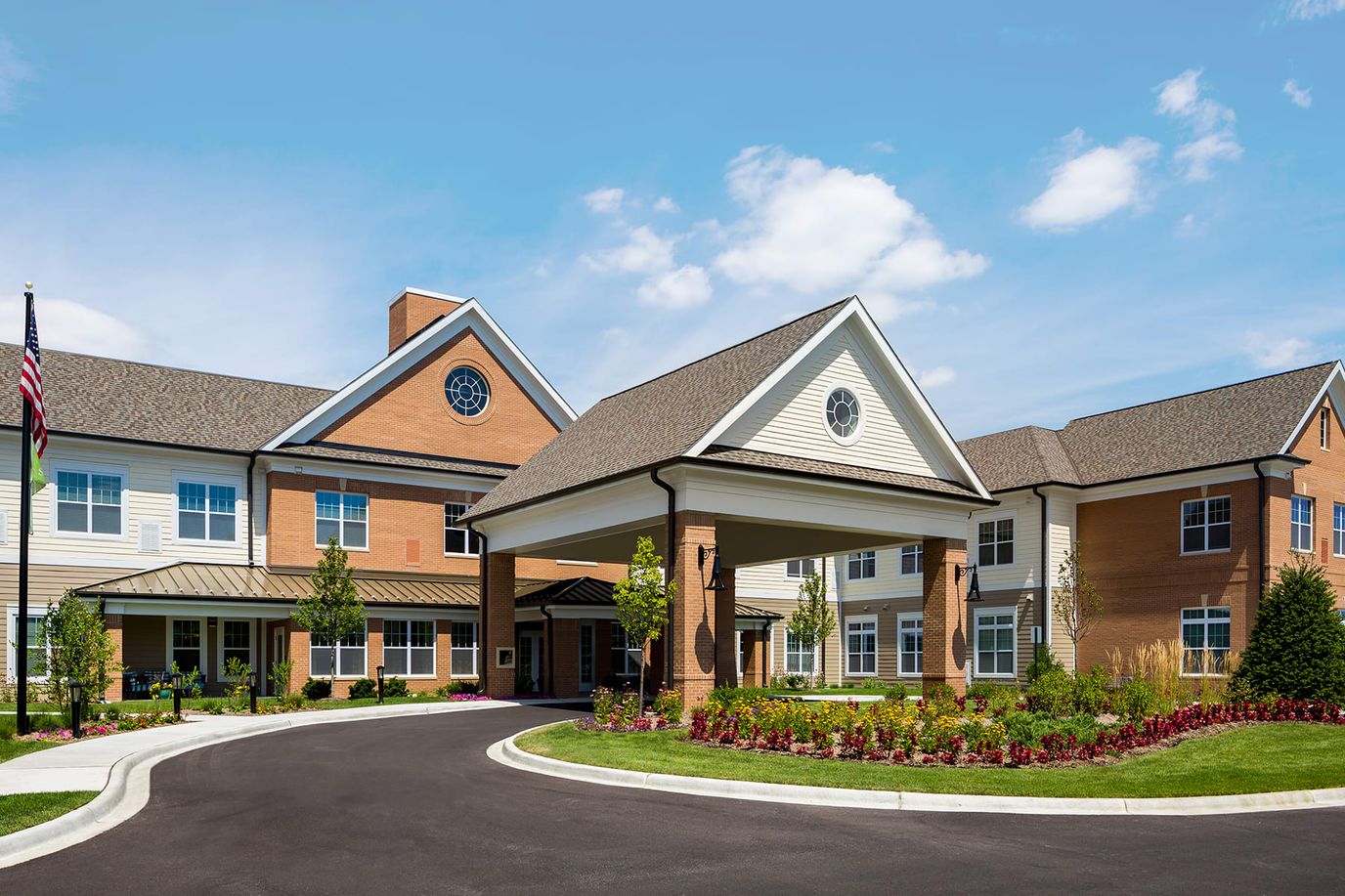 Front entrance of a senior living facility with landscaping