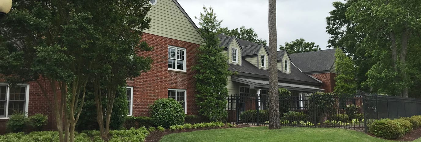 Exterior view of the Arden Courts facility surrounded by greenery