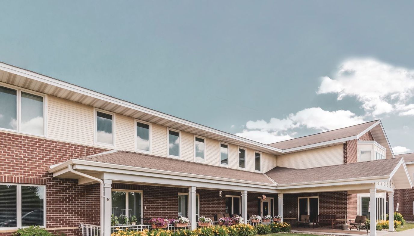 Exterior view of Bethesda Towne Square with flowers
