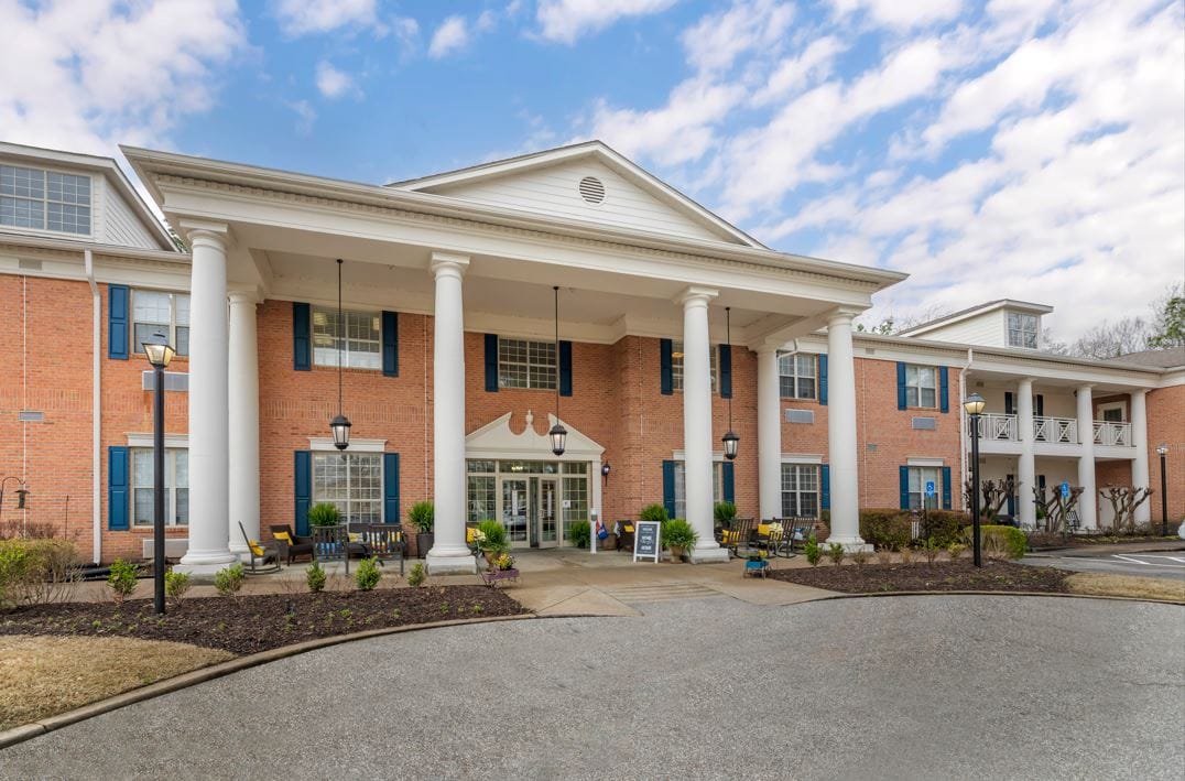 Front exterior of Pointe At Kirby Gate with landscaping