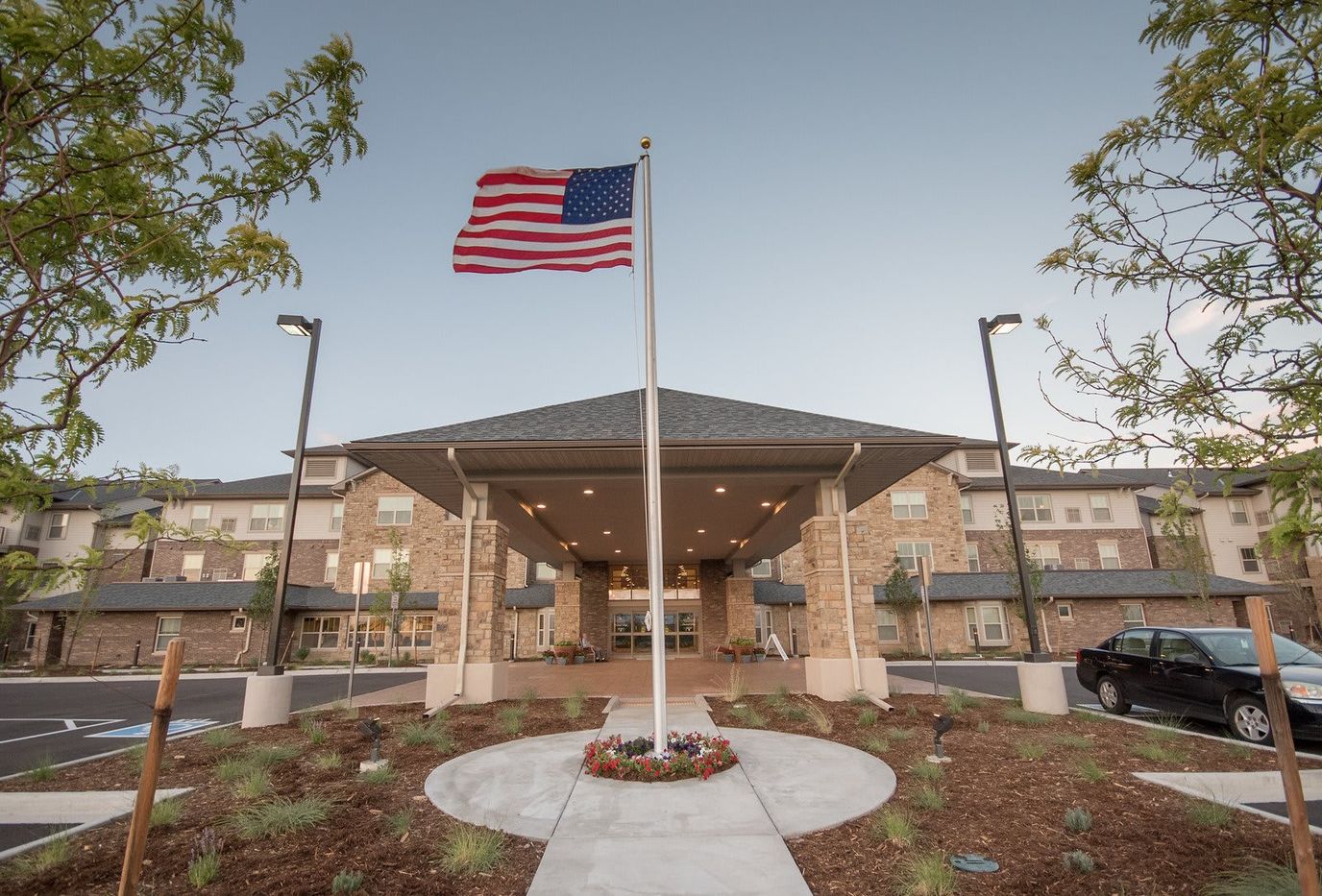 Exterior view of Parkside Village Retirement Resort with flag