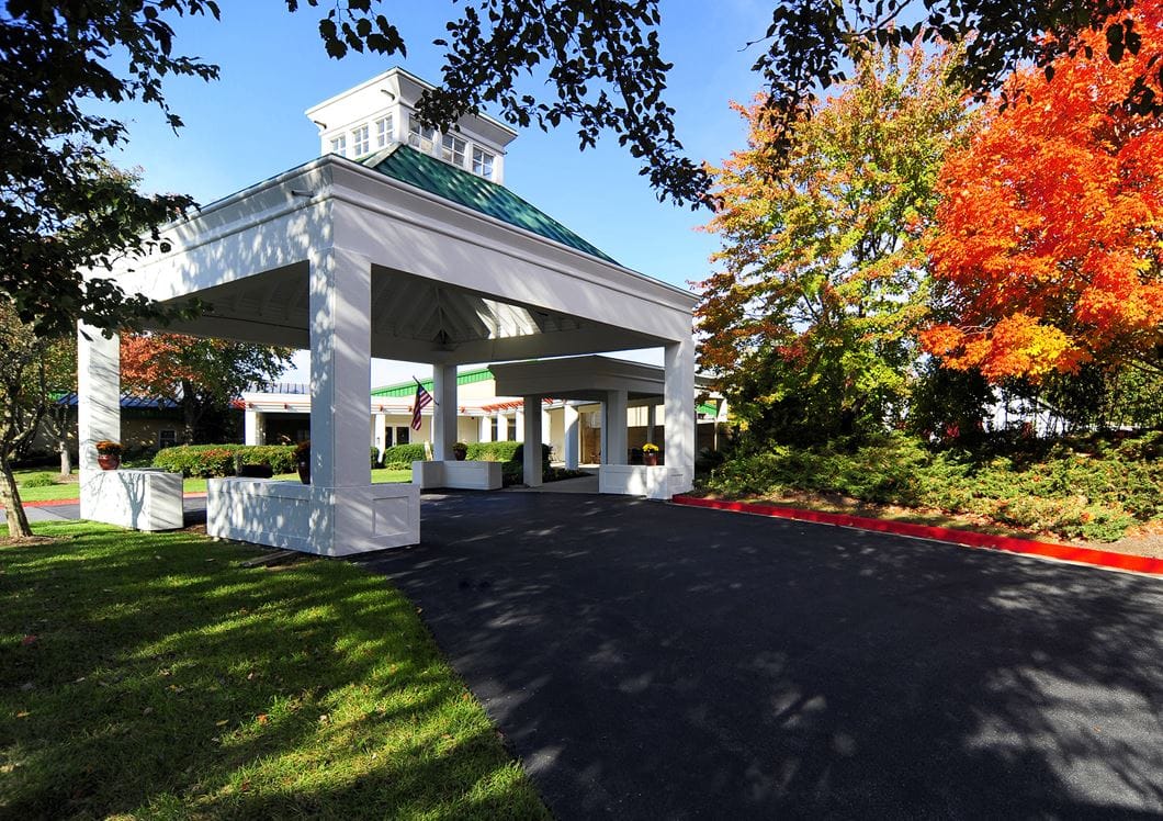 Entrance of Regency Park Assisted Living Facility with fall foliage
