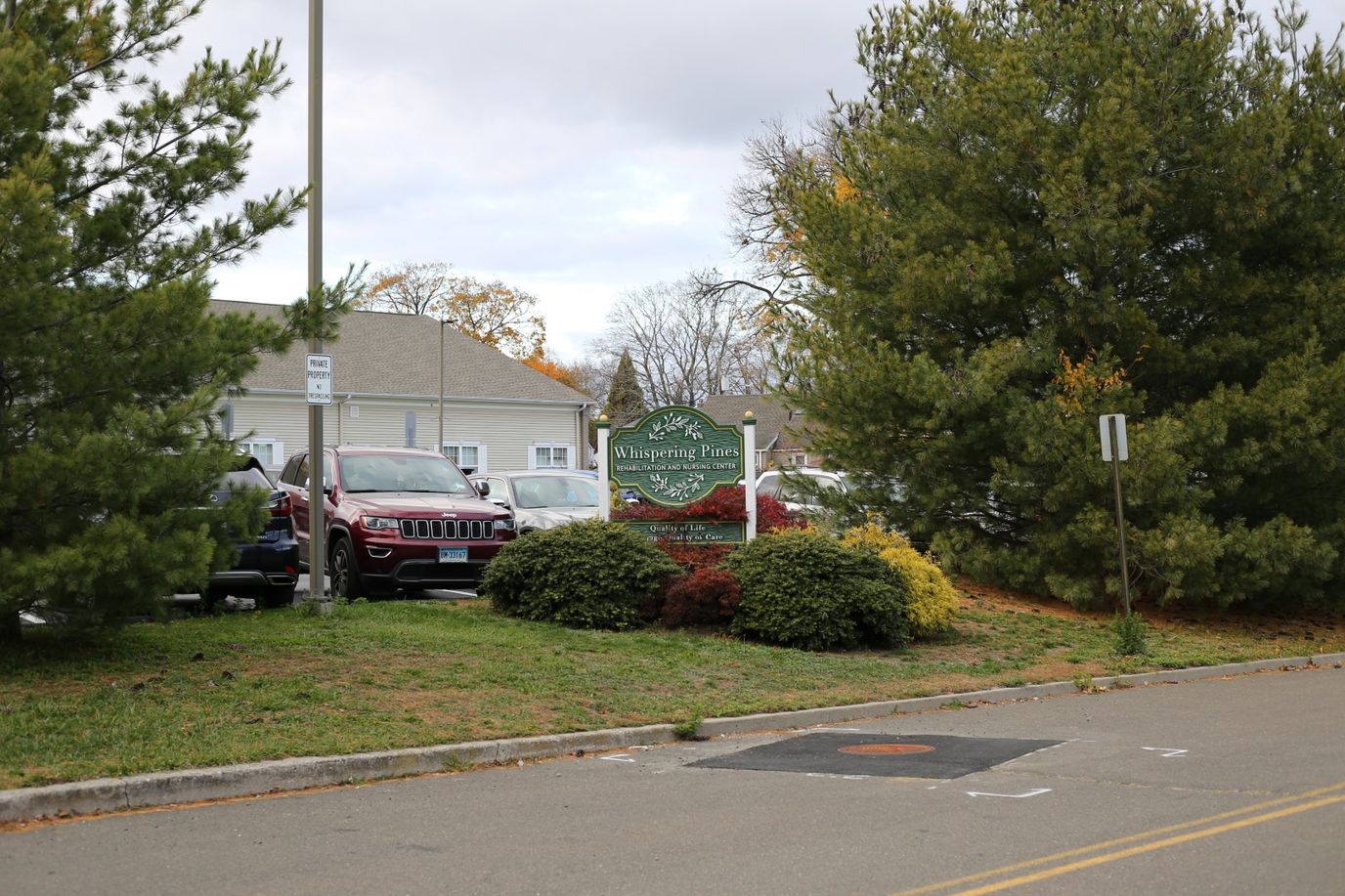 The entrance sign of Whispering Pines Rehabilitation and Nursing Center