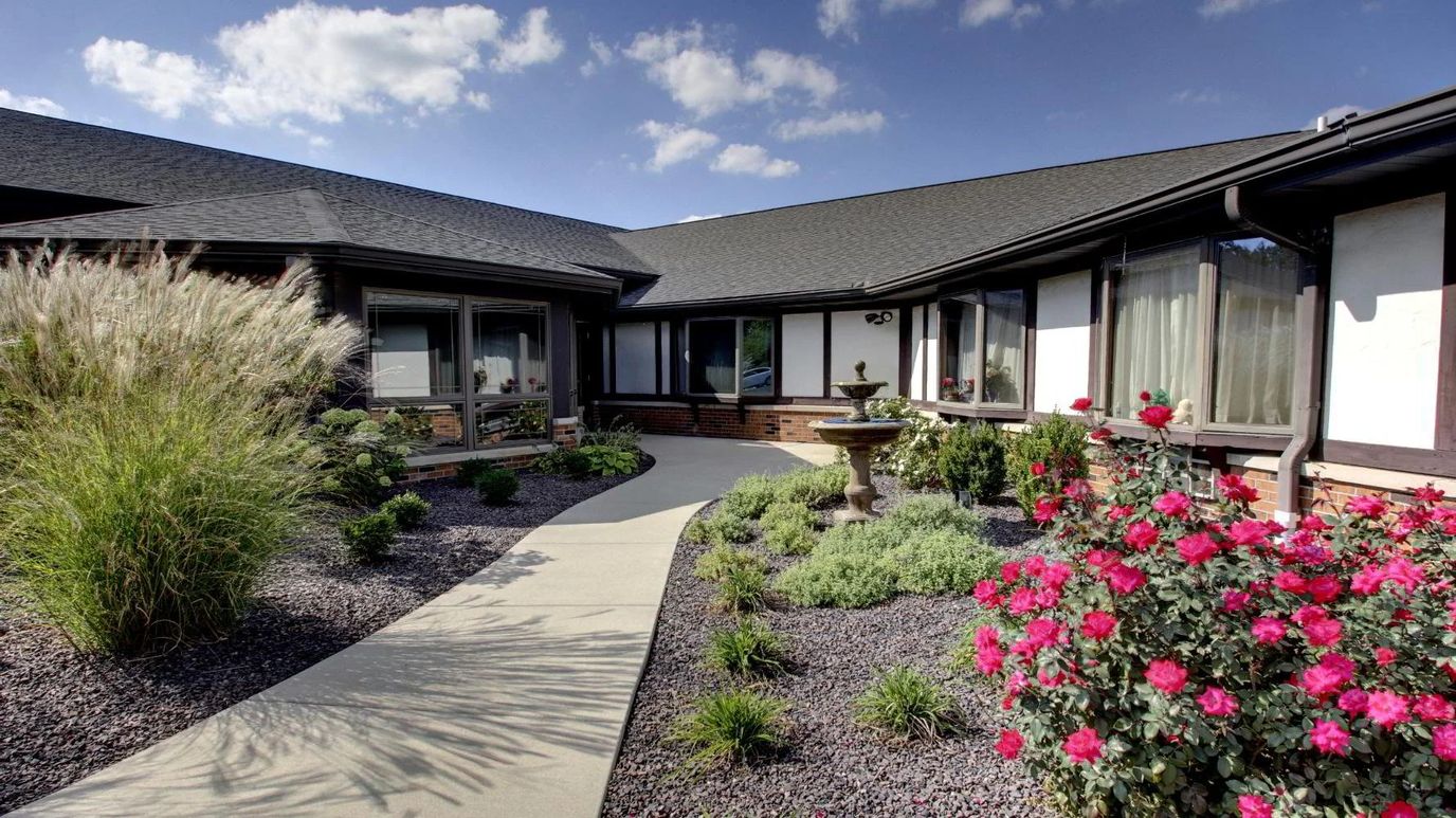 Beautifully landscaped courtyard with flowers and seating area