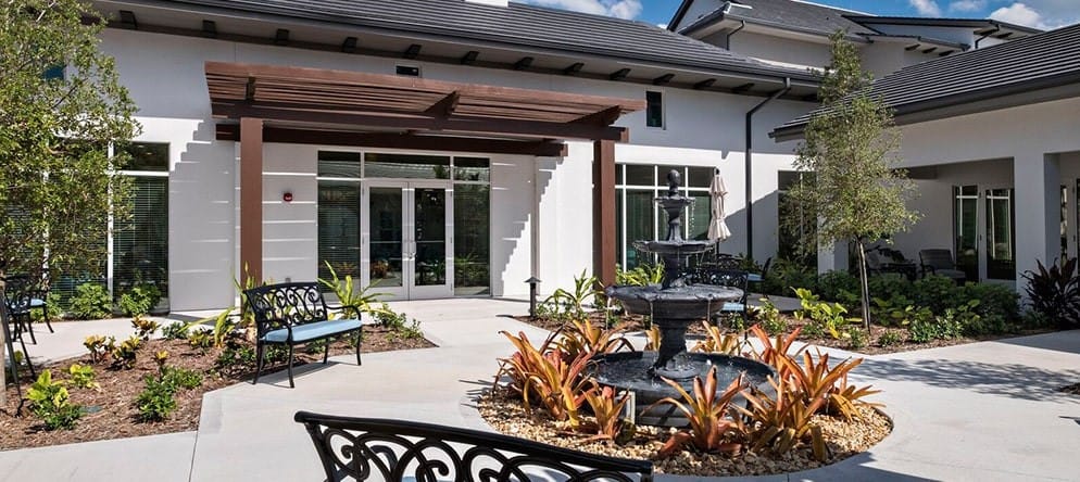 Outdoor courtyard with seating and a water fountain