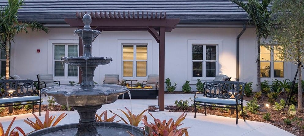 Outdoor courtyard with a fountain and seating area