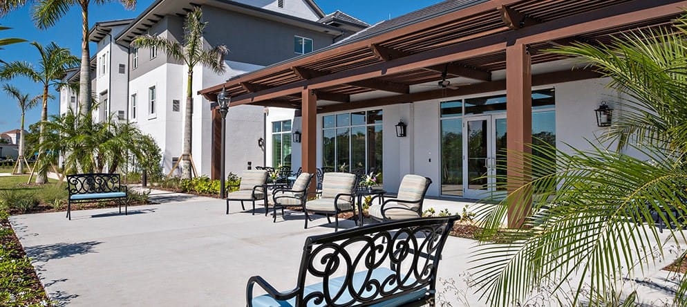 Outdoor seating area with chairs and landscaping