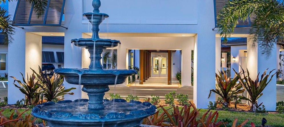 Outdoor view of the facility entrance with fountain