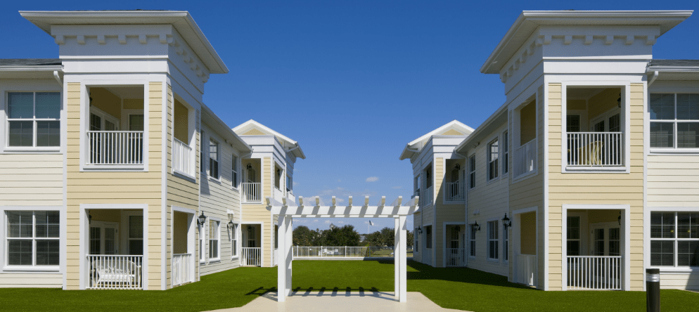 Exterior view of a senior living facility with shared spaces