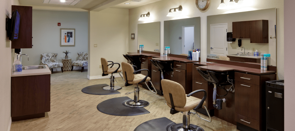 Interior view of a salon with hair styling stations