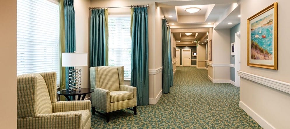 Interior view of a hallway with seating area
