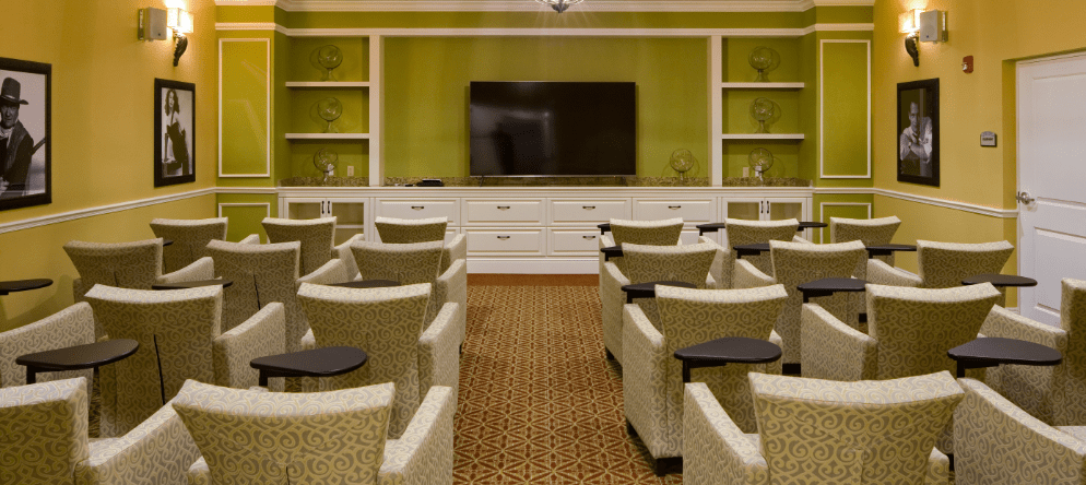 Interior seating area with chairs and a television