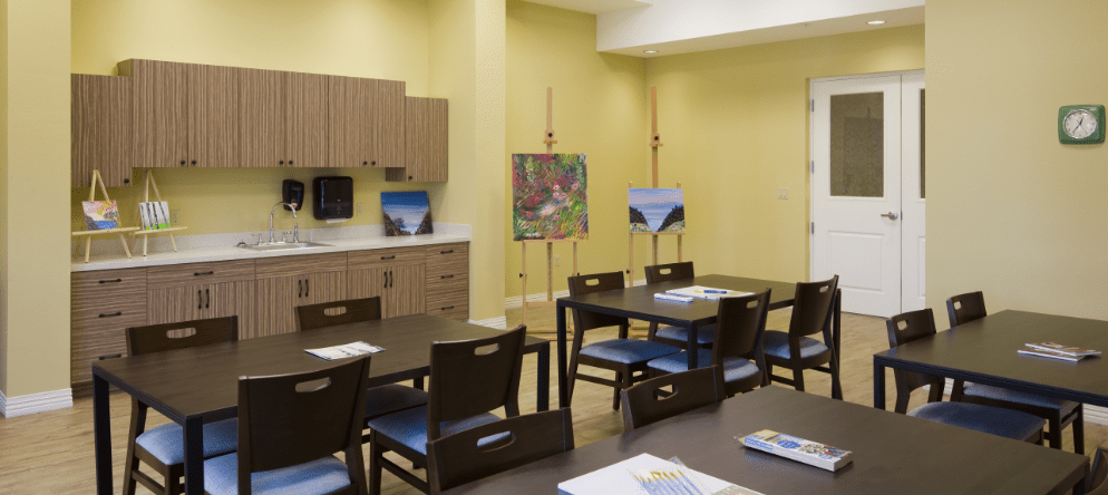 Bright interior room with tables and art supplies