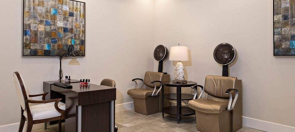 Interior salon area with styling chairs and decor