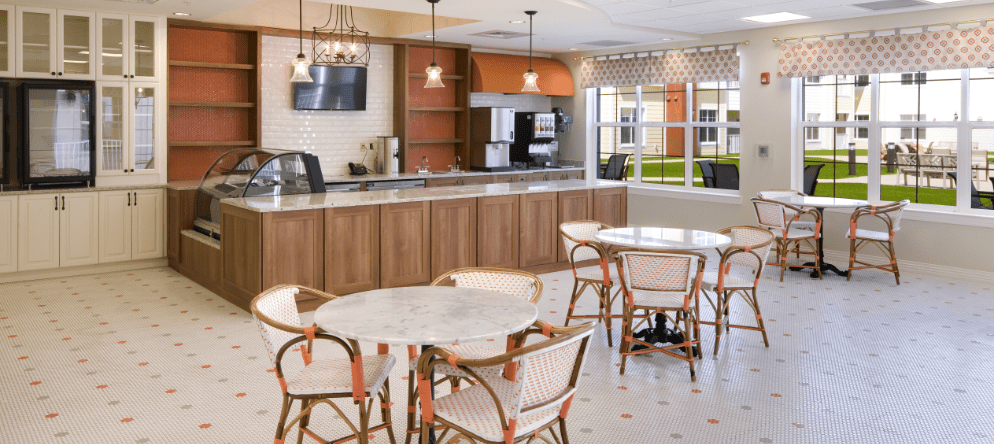 Bright common area with seating and cafe counter