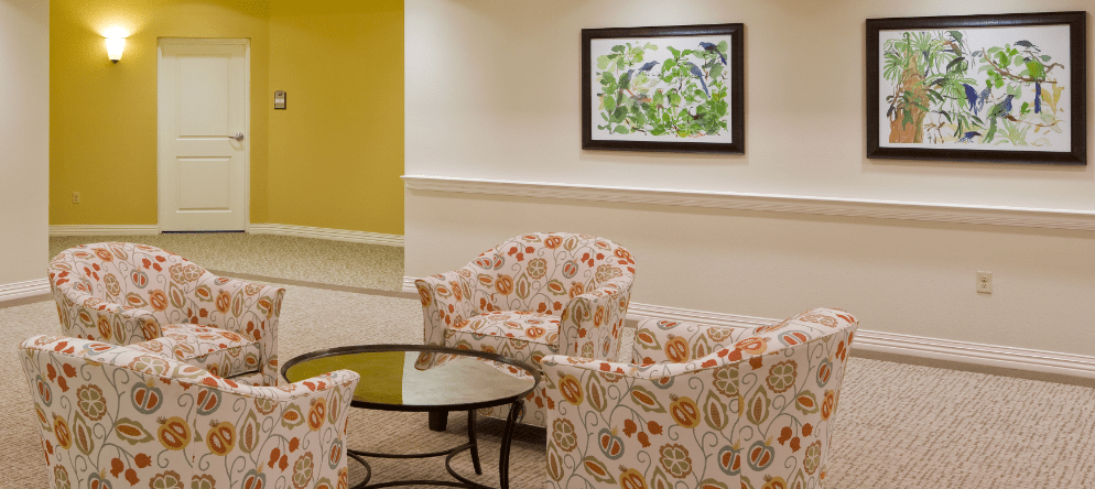 Cozy seating area with colorful chairs and artwork
