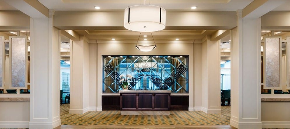 Bright lobby area with a reception desk and modern decor