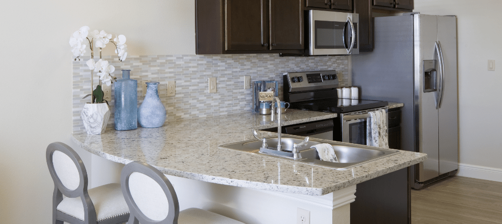 Modern kitchen with granite countertops and appliances