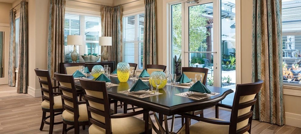 Elegant dining room with table set for a meal