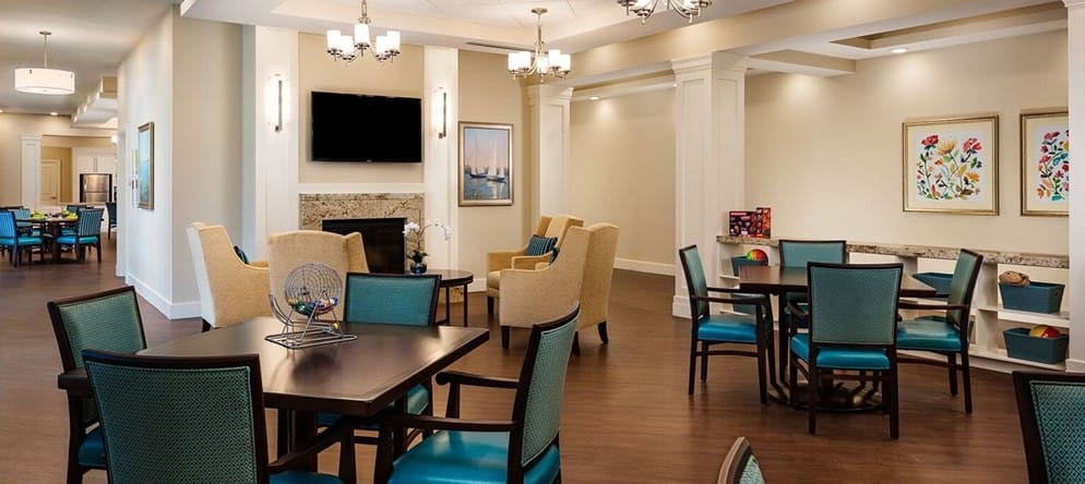 Bright common area with seating and tables