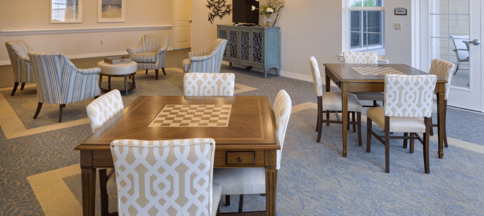 Bright common area with seating and game tables