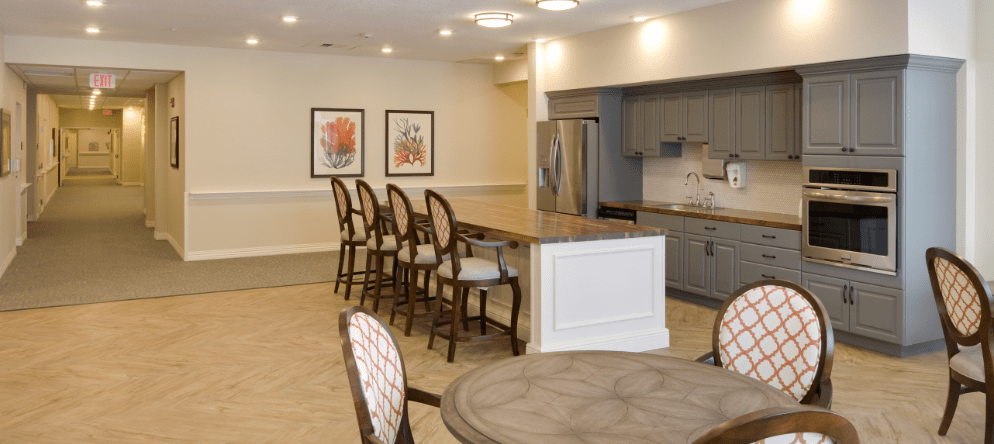 Bright common area with kitchen and seating