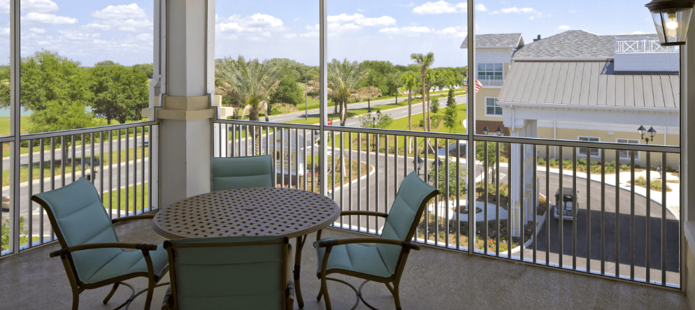 Outdoor seating area overlooking gardens and pathways