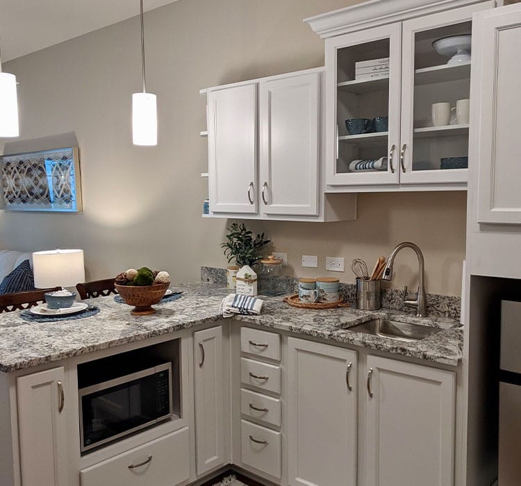 Modern kitchen area with appliances and decor