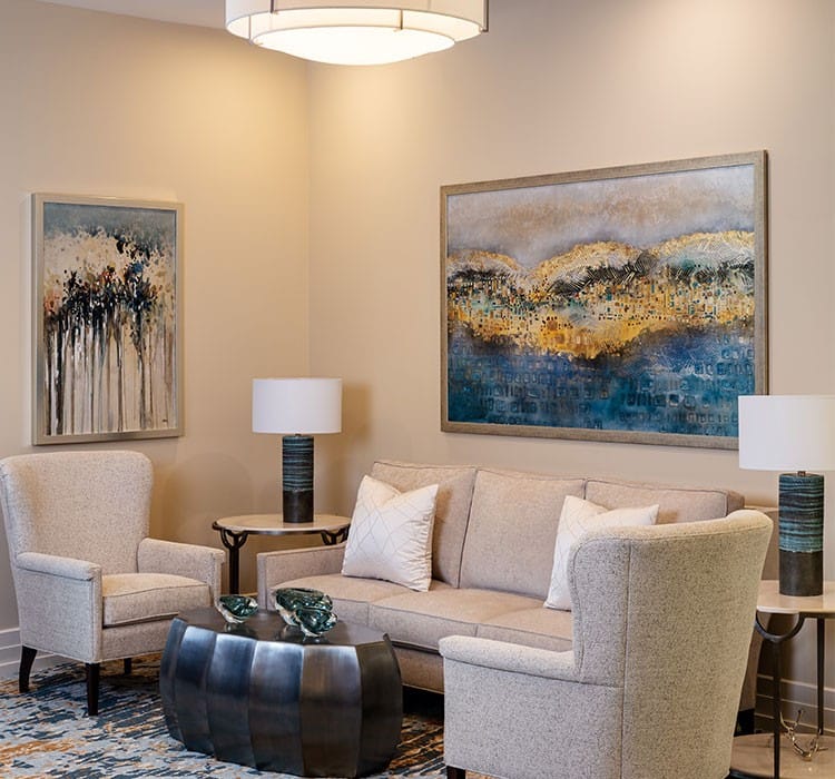 Cozy common area with comfortable seating and artwork