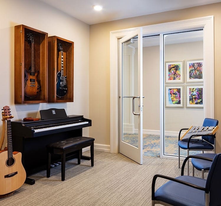 Interior view of a music room with instruments and artwork
