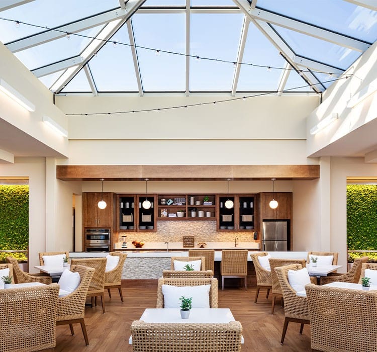 Bright and airy common area with seating and kitchen