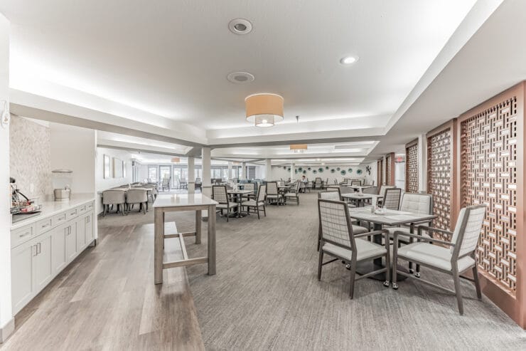 Bright and inviting dining area with tables and chairs.