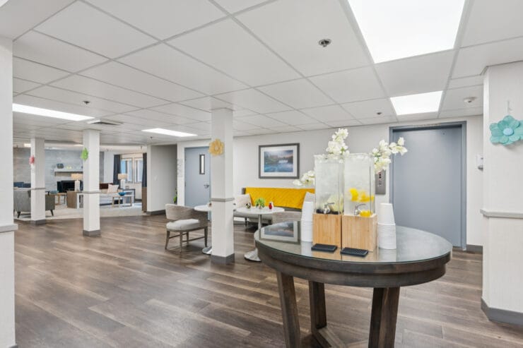 Bright common area with seating and decorations.