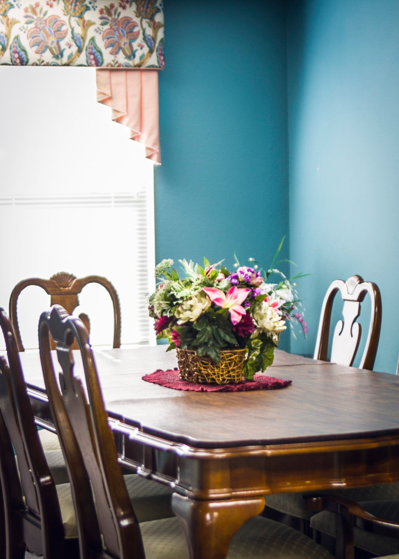Interior view of a dining area with flowers on the table