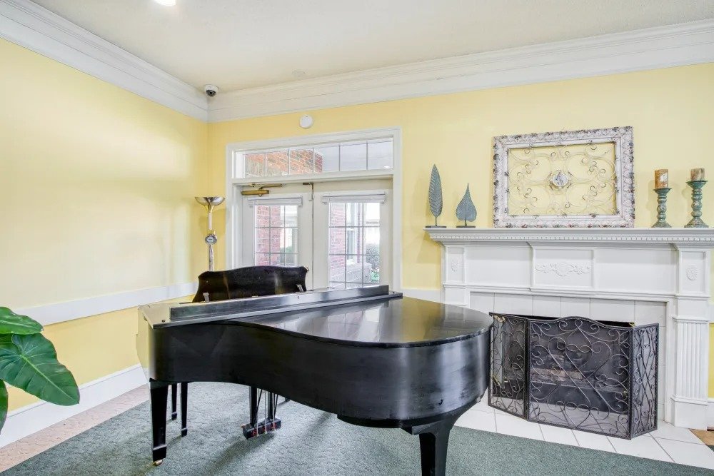 Interior view of a common area featuring a piano