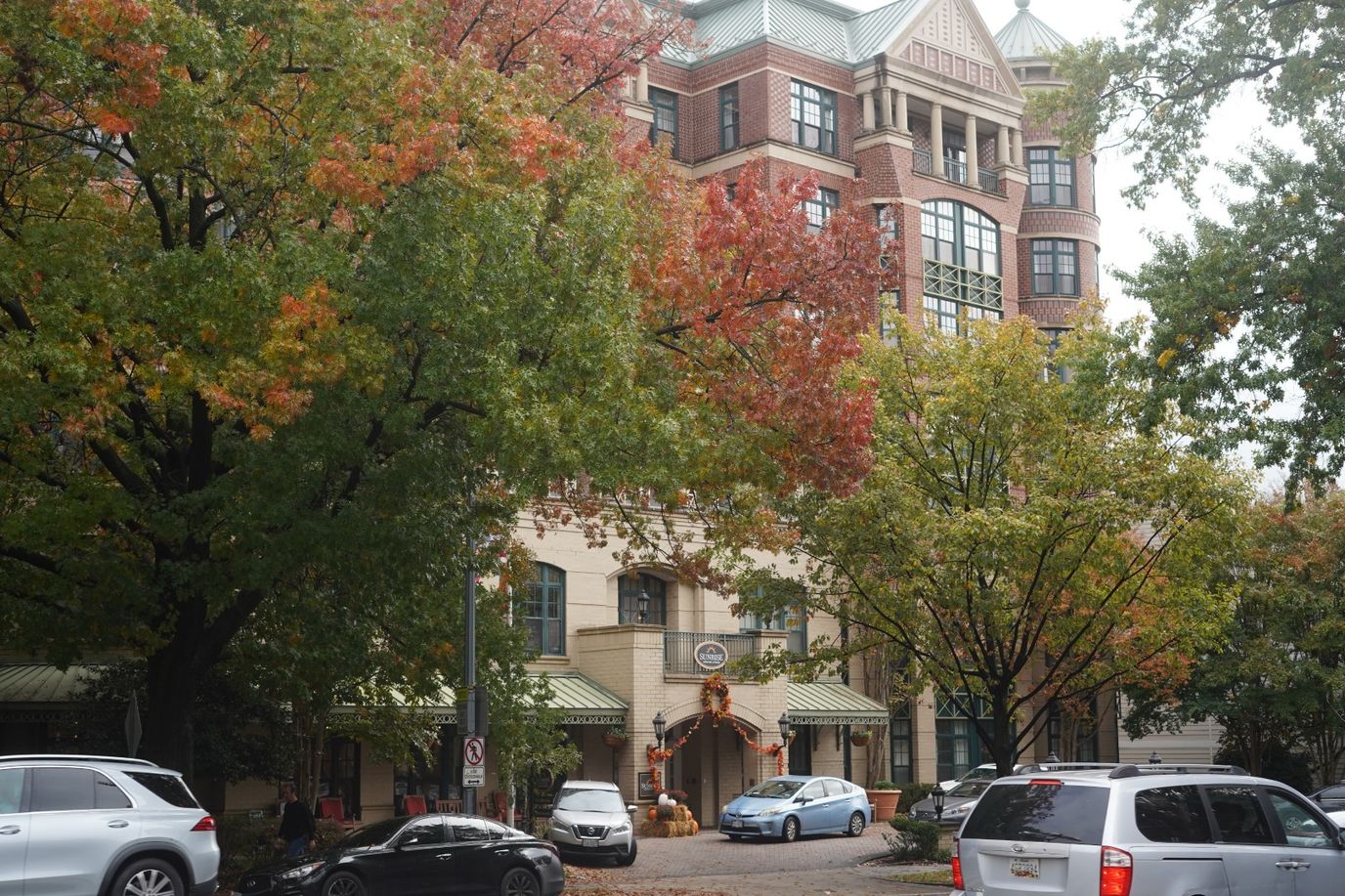 Facade of the facility surrounded by autumn trees