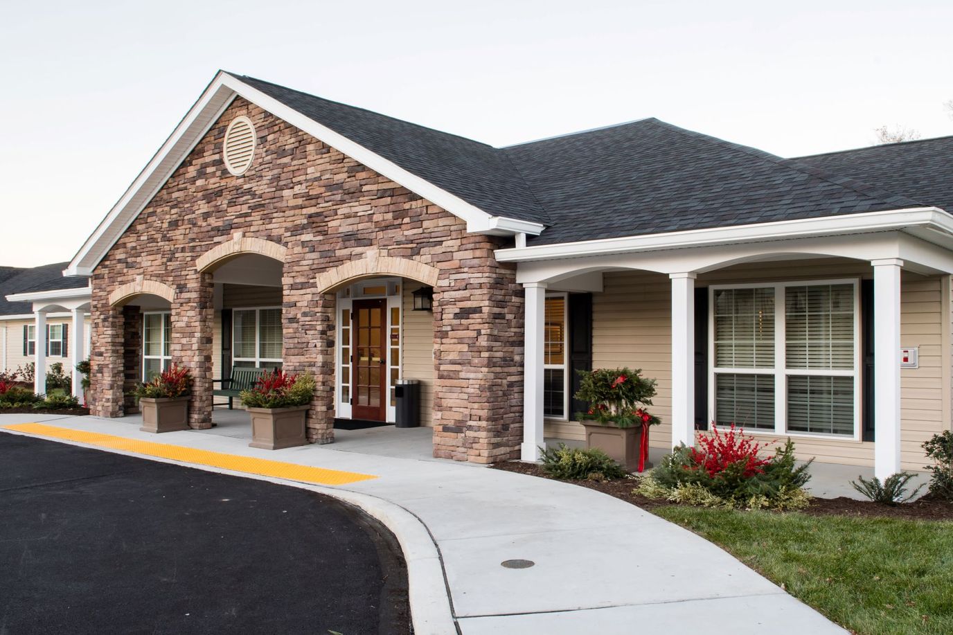Exterior view of a senior living facility with landscaping